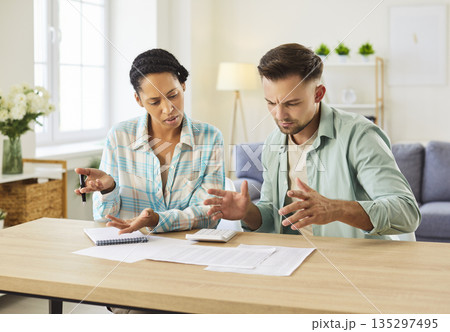 Family couple getting stressed and confused by some mistakes in financial paperwork 135297495