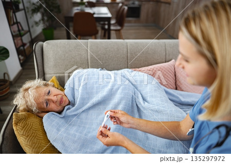 Caring touch inspires hope during a tender moment in a cozy living room 135297972