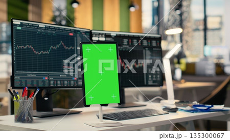 Close up of isolated screen tablet displaying stock market graphs in proprietary firm office. Mockup device on brokerage workspace desk used for stock exchange analysis and strategy planning Close up of isolated screen tablet displaying stock market graphs in proprietary firm office. Mockup device on brokerage workspace desk used for stock exchange analysis and strategy planning 135300067