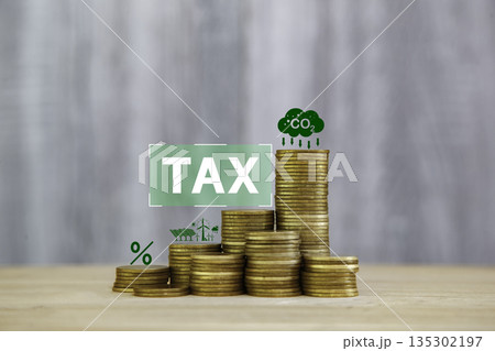 gold coin with CO2, tax, and finance icons representing carbon tax, climate policy, emission reduction, and sustainable economy concept. 135302197