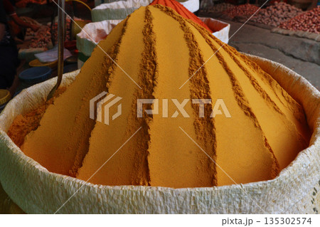 Turmeric powder on bag on shop 135302574