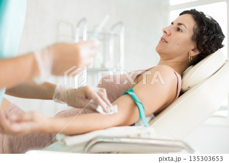 Intravenously injection female patient 135303653