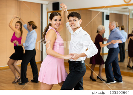 Young pair practicing ballroom dance in dance studio 135303664