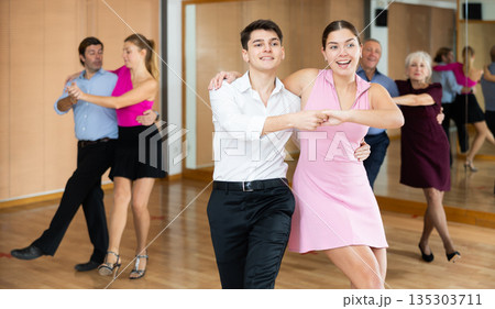 young woman with partner dance jive young woman with partner dance jive 135303711