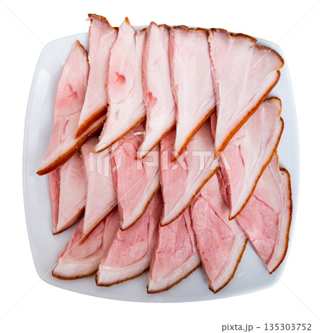 Plate is filled with slices of smoked meat fore shank. 135303752