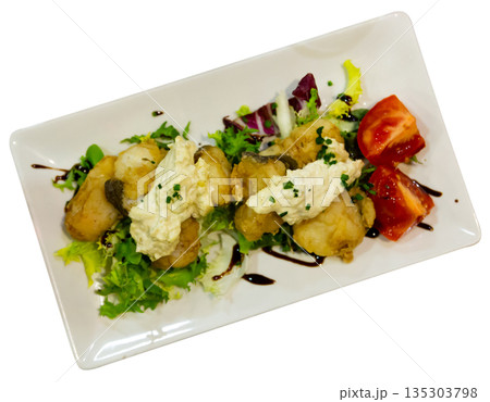 Cod with tartar sauce and herbs on served table 135303798