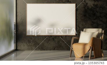 Wooden armchairs and white frame on cement wall in a gallery room with sunlight through glass wall. 135305743