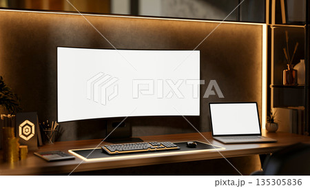 White screen computer with laptop aside gold coins and award plate on wooden table with backlighting White screen computer with laptop aside gold coins and award plate on wooden table with backlighting 135305836