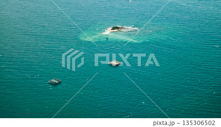 beautiful view of the island with fish cages in the sea 135306502