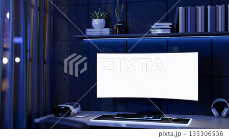 Blank screen computer and vision headset on table with neon blue backlighting aside sheer curtain. Blank screen computer and vision headset on table with neon blue backlighting aside sheer curtain. 135306536