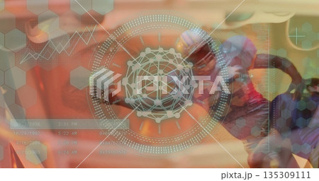 Showing helmeted football player holding ball at data panel, with holographic interface, copy space 135309111