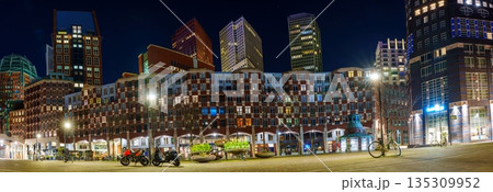 Spectacular Evening View of a Vibrant City Center with Bicycles and Motorcycles Spectacular Evening View of a Vibrant City Center with Bicycles and Motorcycles 135309952