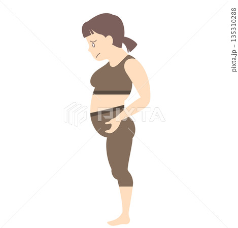 お腹についた脂肪が気になる女性 135310288