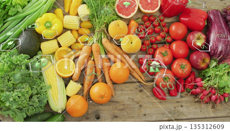Displaying wooden tabletop featuring fresh lettuce, avocado, tomatoes, carrots and eco icons Displaying wooden tabletop featuring fresh lettuce, avocado, tomatoes, carrots and eco icons 135312609
