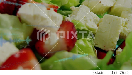 Salad featuring green lettuce strawberry slices, crumbled white cheese on plate, digital overlay Salad featuring green lettuce strawberry slices, crumbled white cheese on plate, digital overlay 135312630