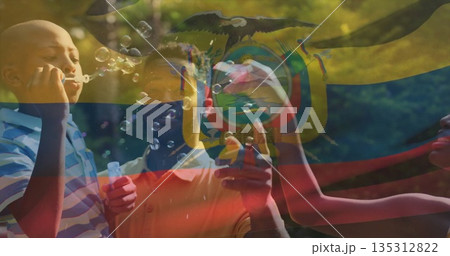 Blowing bubbles family of four holding wands and solution on backyard lawn, under flag overlay Blowing bubbles family of four holding wands and solution on backyard lawn, under flag overlay 135312822