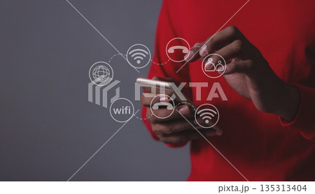Young man hand using smartphone with to Interconnect, Interconnected Concept; People connect via wireless internet in a world of digital technology and communications that connect 135313404