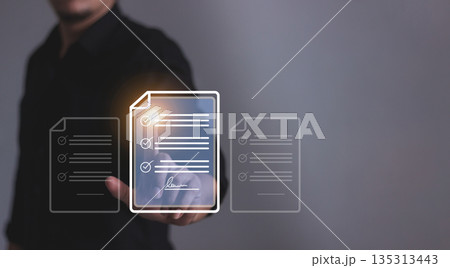 Young man with smartphone mobile hand using a pen touching to sign a Online Business Contract, Electronic signature, Contract signing, Digital documents, Future smart contract 135313443