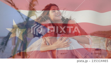 Smiling man carrying woman on back walking along sunny beachfront, with palm tree and lounge chairs Smiling man carrying woman on back walking along sunny beachfront, with palm tree and lounge chairs 135314465