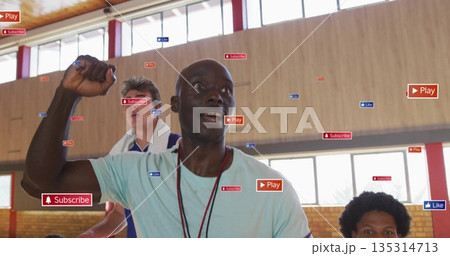 Raising fist coach motivating players in gymnasium, with jerseys whistle Play Subscribe Like icons Raising fist coach motivating players in gymnasium, with jerseys whistle Play Subscribe Like icons 135314713