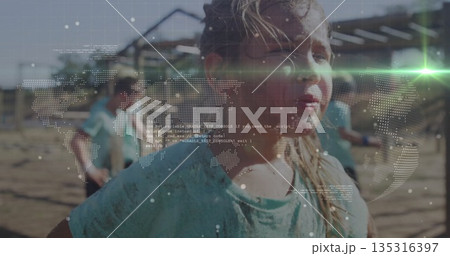 Running muddy child in turquoise shirt through obstacle course with frames and overlay, copy space Running muddy child in turquoise shirt through obstacle course with frames and overlay, copy space 135316397