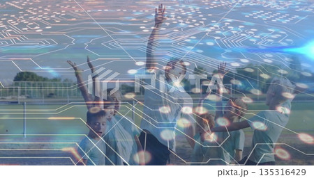 Stretching coach and children in sportswear raising arms on sports field, with soccer goalpost Stretching coach and children in sportswear raising arms on sports field, with soccer goalpost 135316429