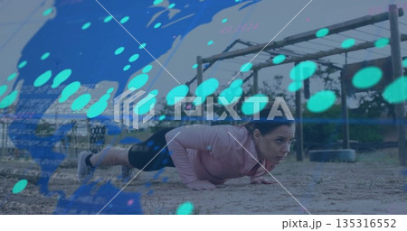 Performing push-up woman wearing pink top, black leggings at obstacle course with metal bars Performing push-up woman wearing pink top, black leggings at obstacle course with metal bars 135316552