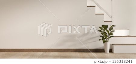 Plant in vase beside white wall and staircase on wooden parquet floor of a modern house or building. 135318241