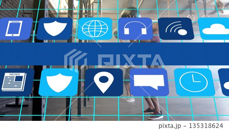 Team in athletic clothing lifting barbells and swinging kettlebells on gym rig with app icon grid 135318624