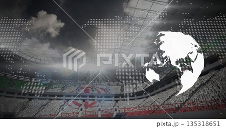 Stadium crowd forming colorful card mosaic in open-roof stadium, with globe graphic and map overlay Stadium crowd forming colorful card mosaic in open-roof stadium, with globe graphic and map overlay 135318651