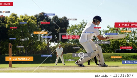 Swinging batsman in white gear hitting ball on cricket pitch, with digital overlays, copy space 135318677