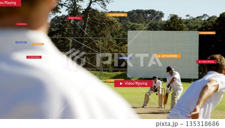 Bowling bowler delivering ball past batsman and keeper at cricket pitch with stumps plus overlays 135318686