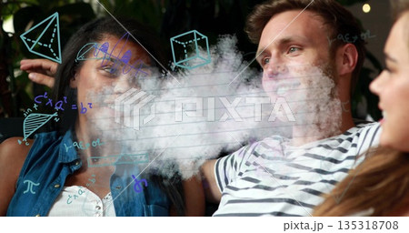 Laughing friends sitting on sofa in lounge area with string lights, vapor cloud and math doodles 135318708