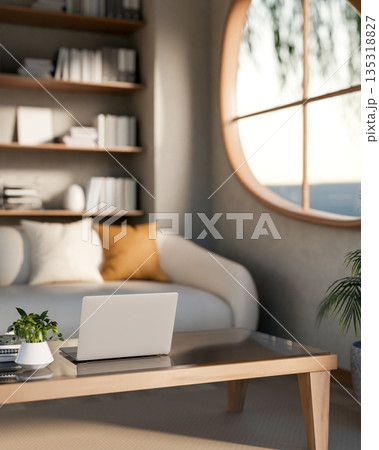 Potted plant and laptop on glass top wooden table and sofa aside bookshelf in room with round window 135318827