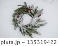Evergreen Wreath with Red Berries Adorn Snow Covered Ground, Copy Space Center 135319422