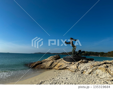 Mermaid statue on rocky beach with sea and sky Ko Samet Thailand 135319684