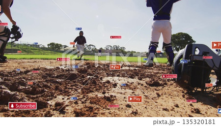 Sprinting jersey runner approaching home plate on diamond, with catcher helmet and mitt 135320181