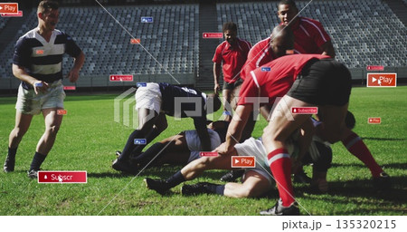 Colliding rugby players competing on stadium pitch, with rugby ball uniforms cleats overlay icons 135320215