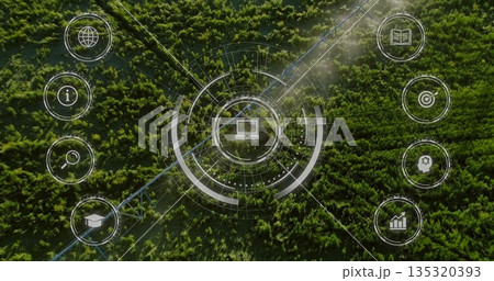 Overlaying concentric circles and laptop icon on forest canopy with pipeline track and icon buttons 135320393