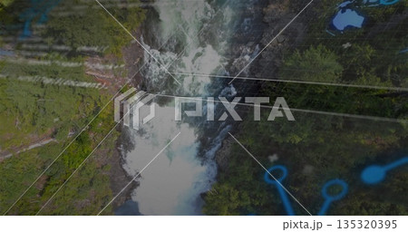 Flowing waterfall cutting through rocky gorge and evergreen forest, with grid lines and blue nodes 135320395