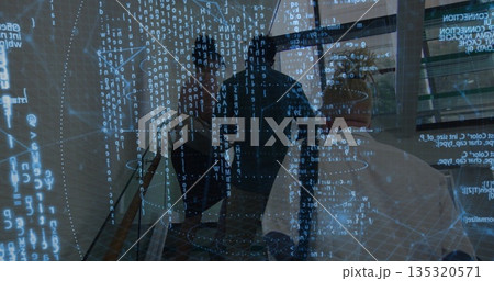 Walking trio of professionals navigating modern office lobby with backpacks, digital projections 135320571