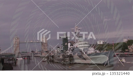 Mooring HMS Belfast warship at wooden pier on River Thames, with Tower Bridge and small boat 135321440