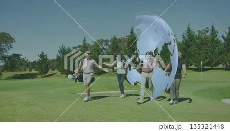 Walking four golfers carrying bags and exchanging high-fives on fairway, with digital globe overlay Walking four golfers carrying bags and exchanging high-fives on fairway, with digital globe overlay 135321448