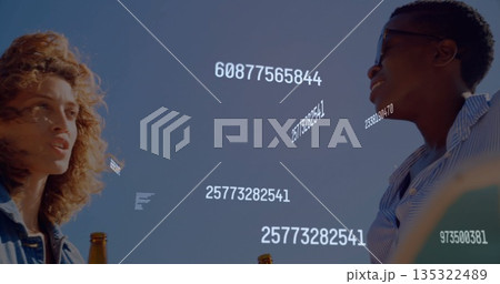 Chatting two women in denim jacket sipping beer on rooftop at dusk with numeric overlays Chatting two women in denim jacket sipping beer on rooftop at dusk with numeric overlays 135322489