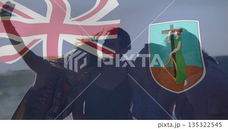 Taking selfie five female friends leaning toward phone sandy beach at dusk, with Union flag overlay 135322545