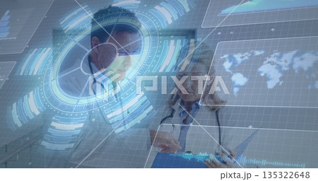 Reviewing hologram data senior doctors in white coats and stethoscopes in clinic, with blue tablet Reviewing hologram data senior doctors in white coats and stethoscopes in clinic, with blue tablet 135322648
