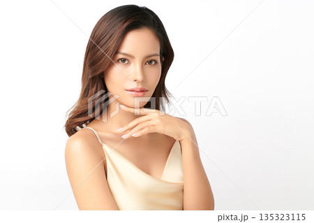 A beautiful young Asian woman with clean, fresh skin against a white background. Skincare, facial treatment, cosmetology, beauty, and spa. An elegant portrait of an Asian woman. A beautiful young Asian woman with clean, fresh skin against a white background. Skincare, facial treatment, cosmetology, beauty, and spa. An elegant portrait of an Asian woman. 135323115