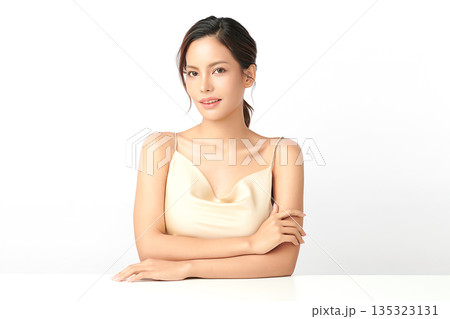 A beautiful young Asian woman with clean, fresh skin against a white background. Skincare, facial treatment, cosmetology, beauty, and spa. An elegant portrait of an Asian woman. A beautiful young Asian woman with clean, fresh skin against a white background. Skincare, facial treatment, cosmetology, beauty, and spa. An elegant portrait of an Asian woman. 135323131