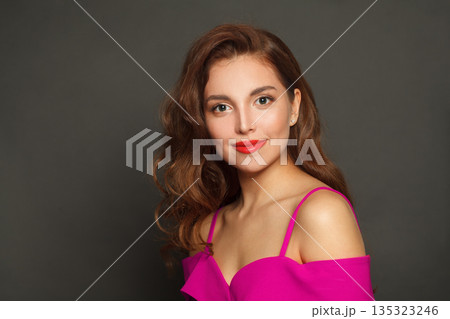Beauty portrait of woman with long hair and make-up on black background. Beauty portrait of woman with long hair and make-up on black background. 135323246