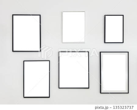 Minimalist composition of six empty photo frames in black and white, arranged on a neutral light 135323737